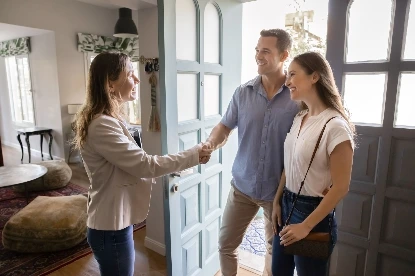 Prospective buyers touring a home at an open house