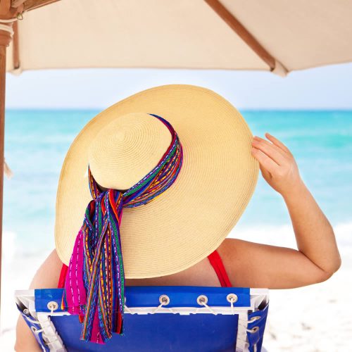 Homes-in-Mexico-woman-with-hat-beach-playa-del-carmen-o